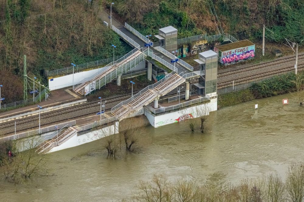 Essen from above - Flood situation and flooding, all-rousing and infrastructure-destroying masses of brown water on Bahnhof Holthausen in the district Ueberruhr - Holthausen in Essen at Ruhrgebiet in the state North Rhine-Westphalia, Germany