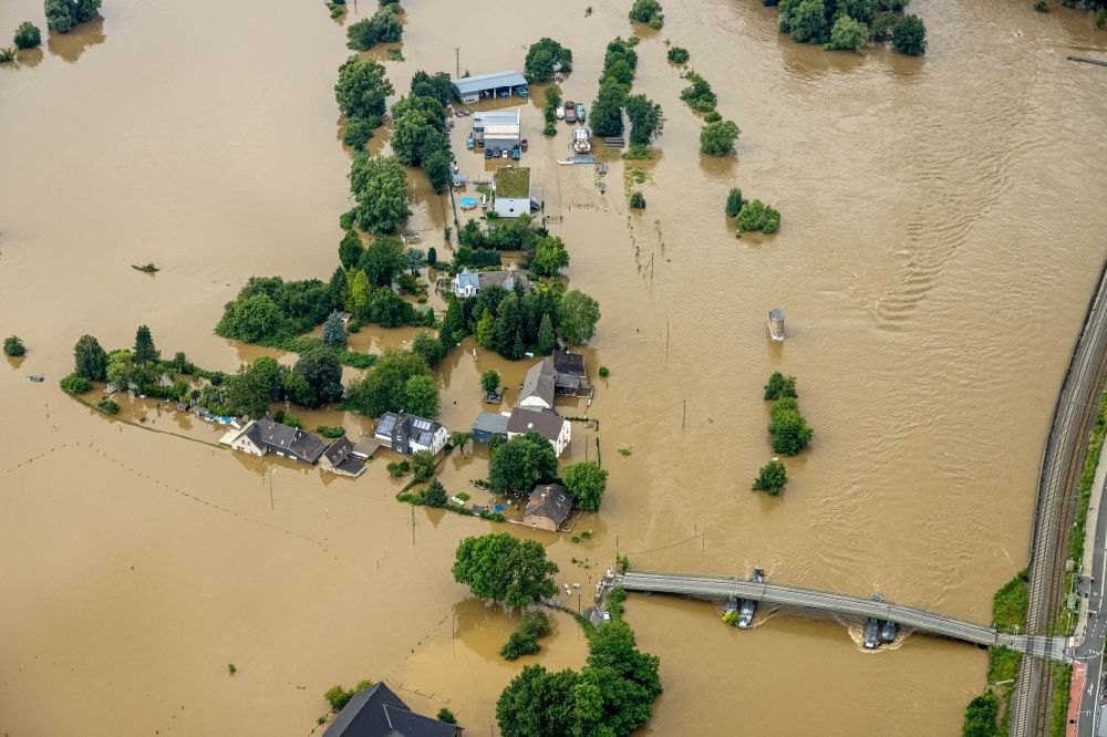 Bochum from the bird's eye view: Flood situation and flooding, all-rousing and infrastructure-destroying masses of brown water along the Ruhr in the district Dahlhausen in Bochum at Ruhrgebiet in the state North Rhine-Westphalia, Germany