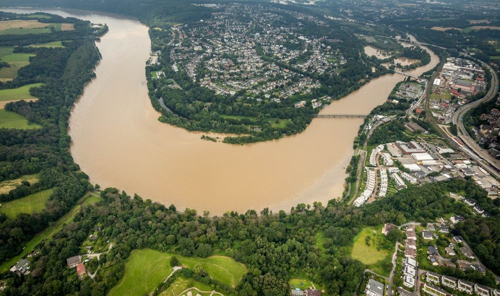 Essen from the bird's eye view: Flood situation and flooding, all-rousing and infrastructure-destroying masses of brown water along the Ruhr in the district Heisingen in Essen at Ruhrgebiet in the state North Rhine-Westphalia, Germany