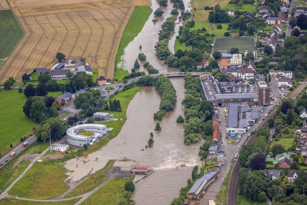 Langschede from above - Flood situation and flooding, all-rousing and infrastructure-destroying masses of brown water along the Ruhr in Langschede in the state North Rhine-Westphalia, Germany