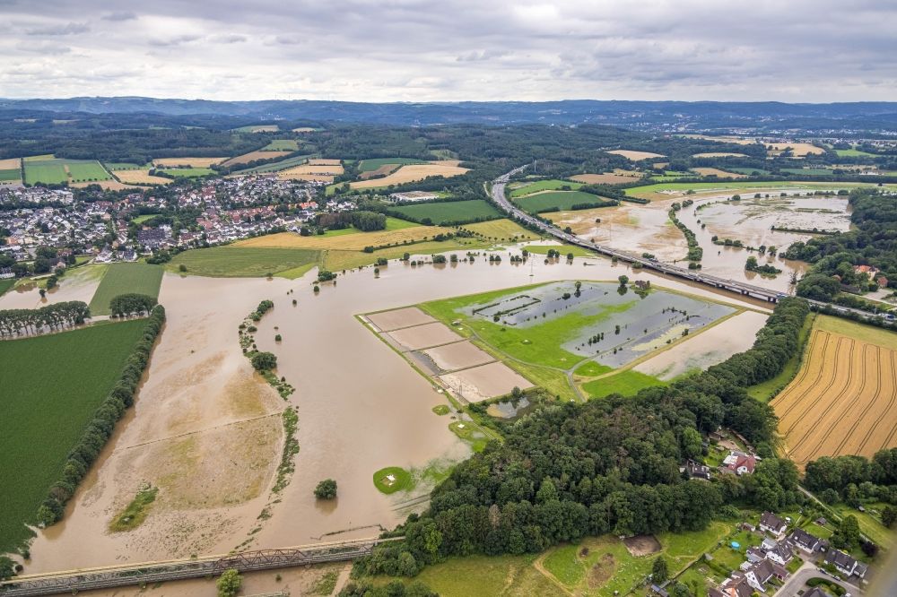Aerial photograph Schwerte - Flood situation and flooding, all-rousing and infrastructure-destroying masses of brown water along the Ruhr in Schwerte in the state North Rhine-Westphalia, Germany