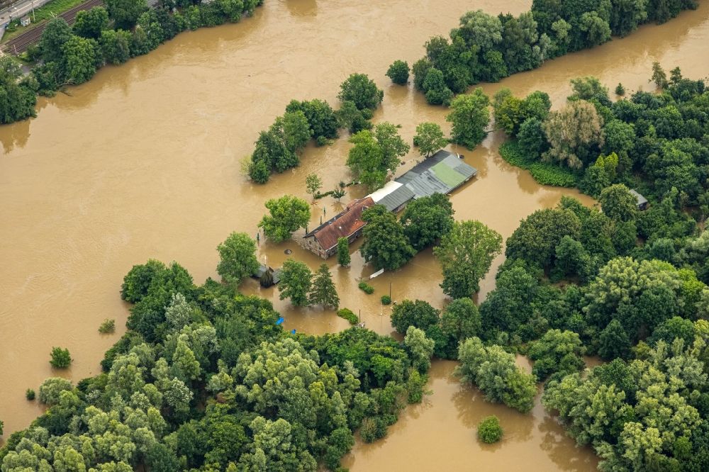 Aerial image Essen - Flood situation and flooding, all-rousing and infrastructure-destroying masses of brown water on Faehrhaus Rote Muehle in the district Heisingen in Essen at Ruhrgebiet in the state North Rhine-Westphalia, Germany