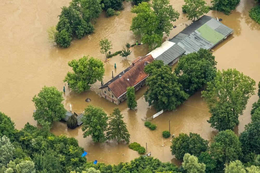 Aerial photograph Essen - Flood situation and flooding, all-rousing and infrastructure-destroying masses of brown water on Faehrhaus Rote Muehle in the district Heisingen in Essen at Ruhrgebiet in the state North Rhine-Westphalia, Germany