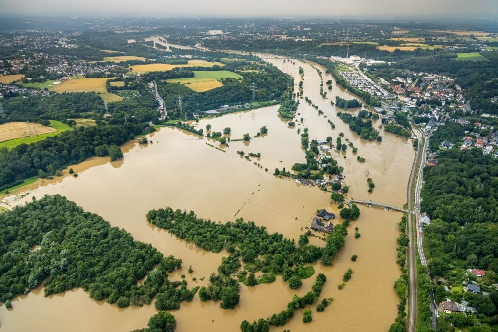 Aerial image Bochum - Flood situation and flooding, all-rousing and infrastructure-destroying masses of brown water on the course of the river Ruhr in the district Dahlhausen in Bochum at Ruhrgebiet in the state North Rhine-Westphalia, Germany