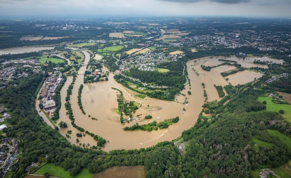 Witten from the bird's eye view: Flood situation and flooding, all-rousing and infrastructure-destroying masses of brown water on the course of the river Ruhr in the district Heven in Witten at Ruhrgebiet in the state North Rhine-Westphalia, Germany