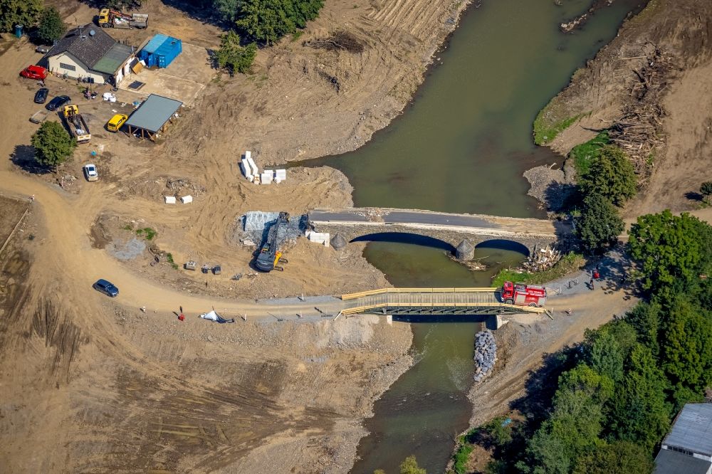 Hönningen from the bird's eye view: Flood damage and reconstruction construction sites in the floodplain on riverside of Ahr in Hoenningen in the state Rhineland-Palatinate, Germany