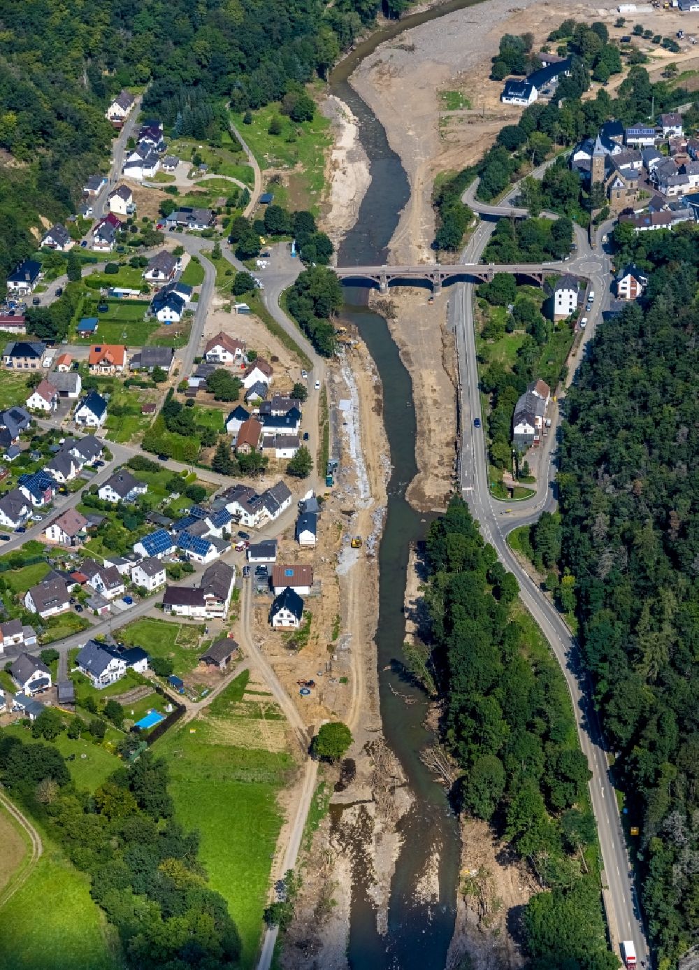Hönningen from the bird's eye view: Flood damage and reconstruction construction sites in the floodplain on riverside of Ahr in Hoenningen in the state Rhineland-Palatinate, Germany