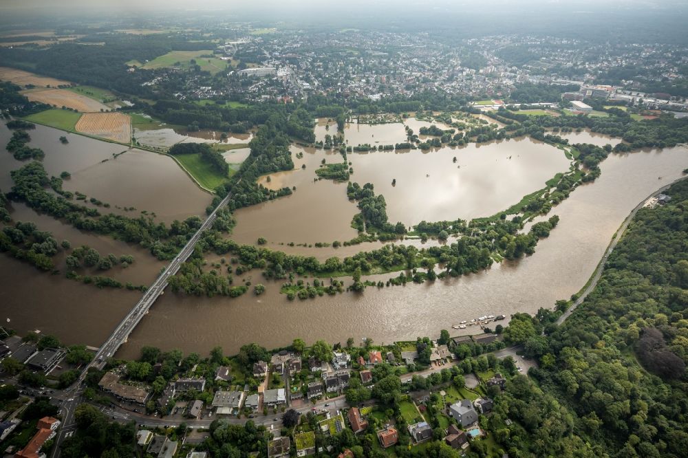 Aerial image Mülheim an der Ruhr - Flood situation and flooding, all-rousing and infrastructure-destroying masses of brown water on the course of the Ruhr in Muelheim on the Ruhr at Ruhrgebiet in the state North Rhine-Westphalia, Germany