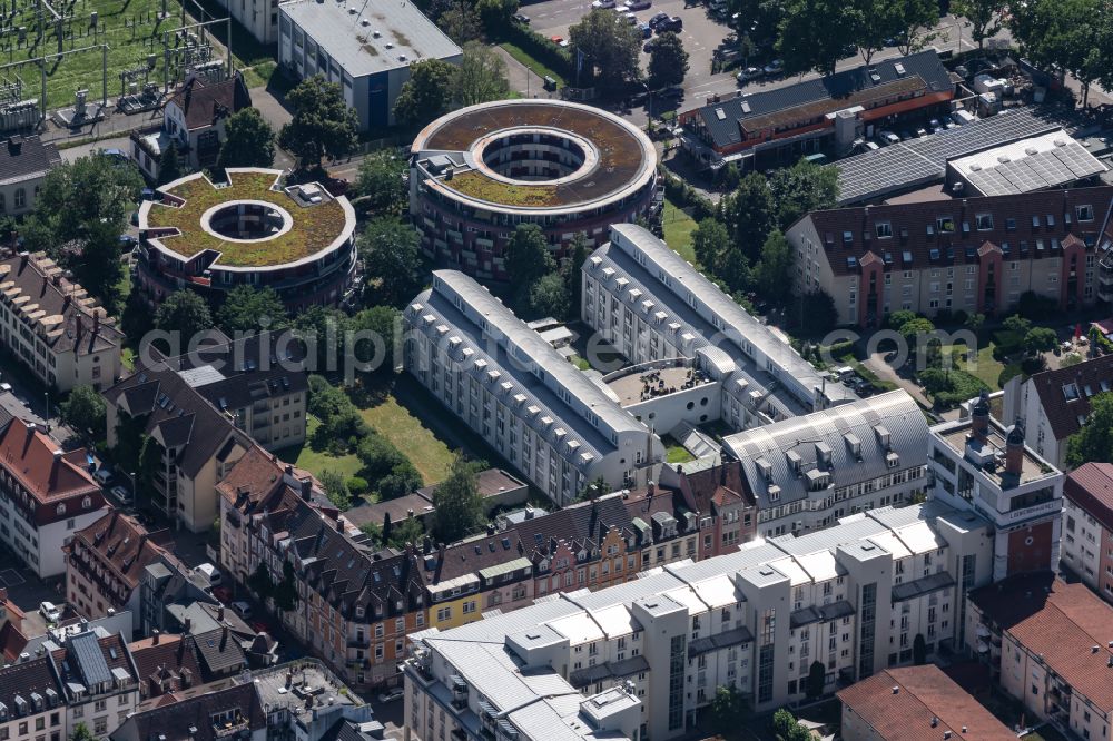 Aerial photograph Freiburg im Breisgau - Building complex of the StayInn Freiburg holiday apartments, hostel and guest house and the round houses of the Urania Freiburg in Freiburg im Breisgau in the state Baden-Wuerttemberg, Germany