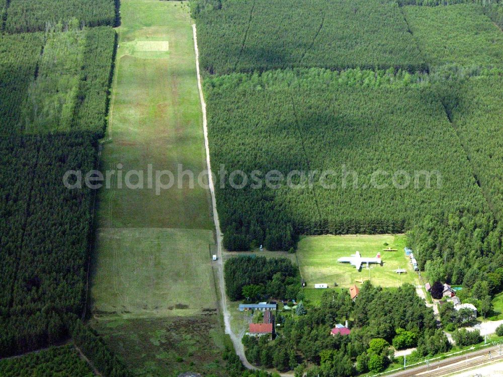 Borkheide from the bird's eye view: IL-18 DDR-STE of GDR- airline INTERFLUG on exhibition grounds of the Hans Grade Museum with airplanes and helicopers at Postway in Borkheide in the state Brandenburg