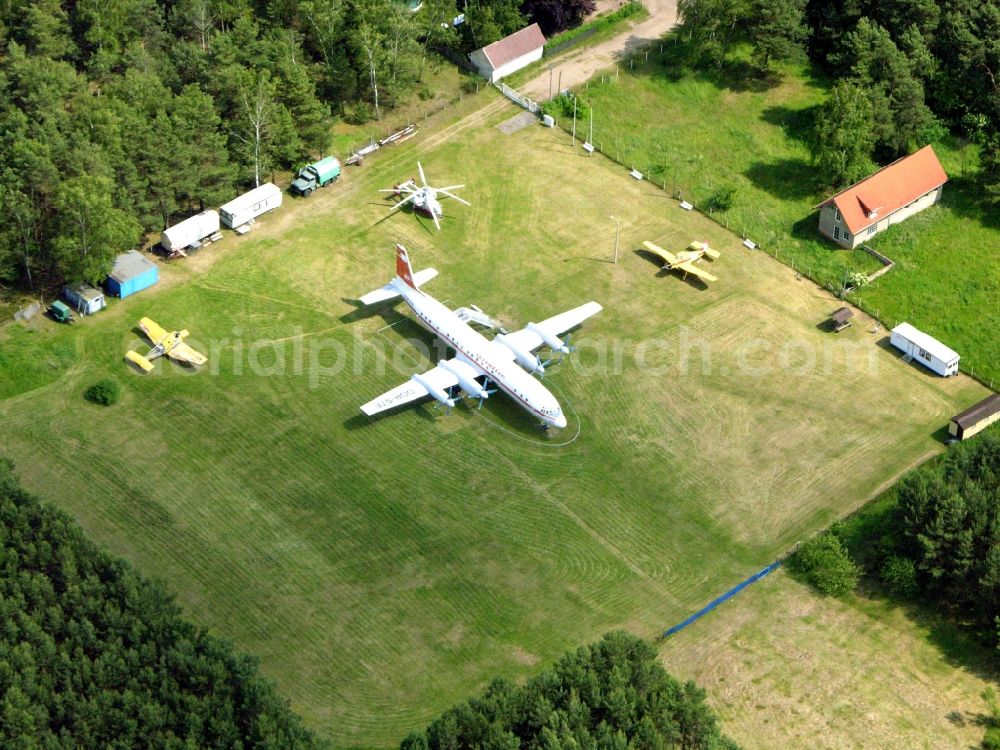 Borkheide from the bird's eye view: IL-18 DDR-STE of GDR- airline INTERFLUG on exhibition grounds of the Hans Grade Museum with airplanes and helicopers at Postway in Borkheide in the state Brandenburg