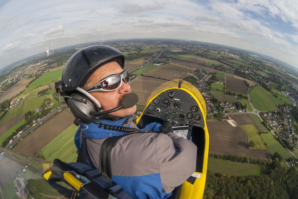 Dortmund from above - Fisheye view out of a gyrocopter in flight with the registration D-MCMD above the urban area of Dortmund in the federal state North Rhine-Westphalia