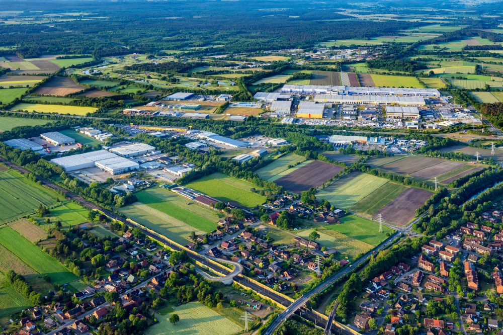 Winsen (Luhe) from the bird's eye view: Industrial and commercial area south exit Winsen A39 in Winsen (Luhe) in the state Lower Saxony, Germany