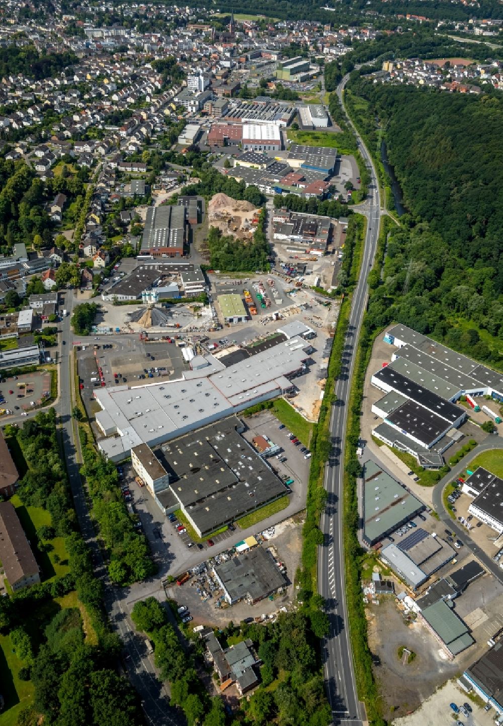 Arnsberg from the bird's eye view: Industrial and commercial area along the Landstrasse L745 in Arnsberg in the state North Rhine-Westphalia, Germany