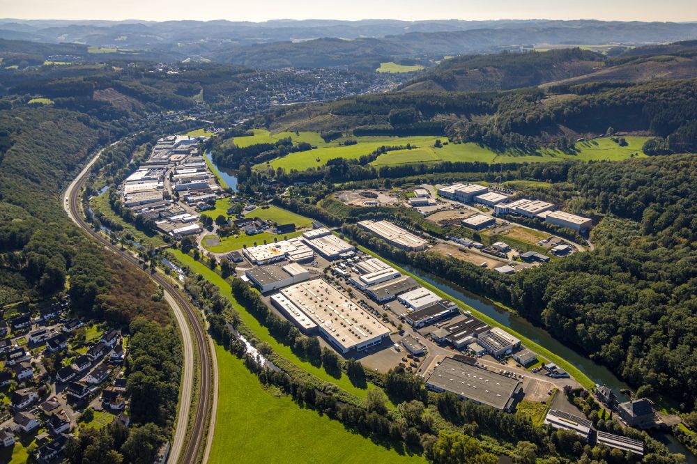 Finnentrop from the bird's eye view: Industrial and commercial area along the Industriestrasse in Finnentrop in the state North Rhine-Westphalia, Germany