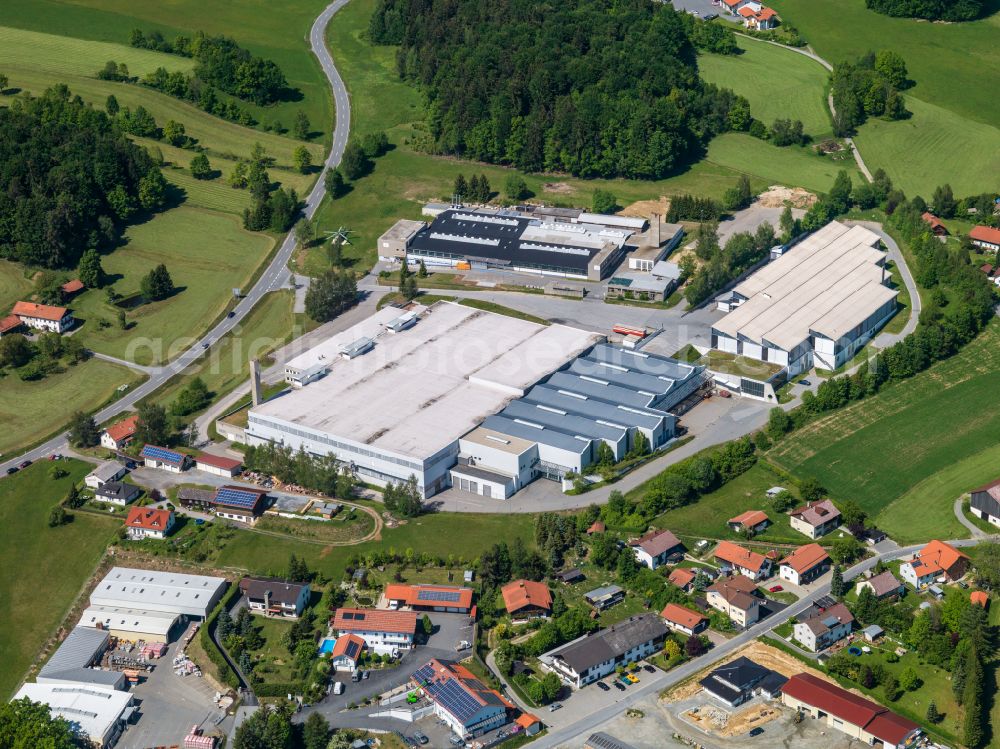 Aerial photograph Freyung - Industrial and commercial area of Firmen Hirschmann Automotive GmbH, FM Textilhandels GmbH and the Max Fuchs AG in the district Speltenbach in Freyung in the state Bavaria, Germany
