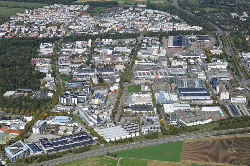 Aerial image Freiburg im Breisgau - Industrial and commercial area Haid and behind it district Rieselfeld in Freiburg im Breisgau in the state Baden-Wurttemberg, Germany