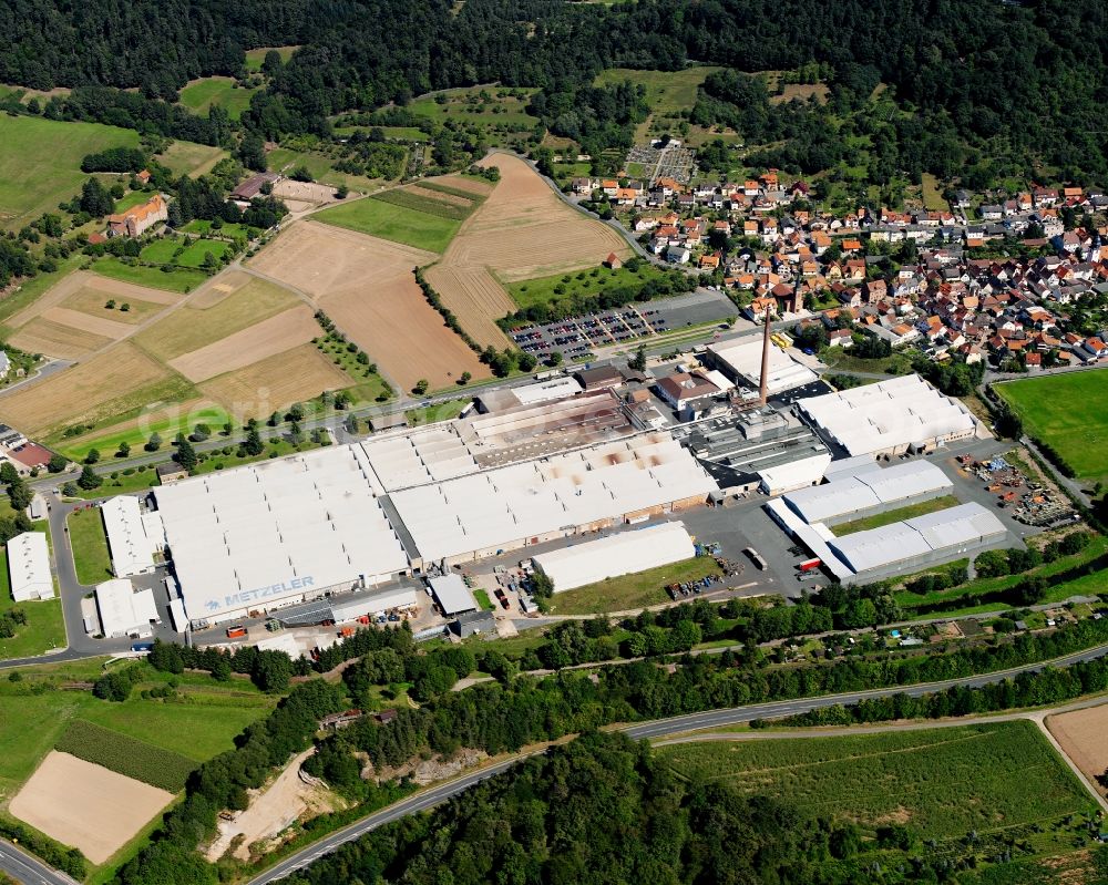 Neustadt from the bird's eye view: Industrial and commercial area on the edge of agricultural fields in Neustadt in the state Hesse, Germany