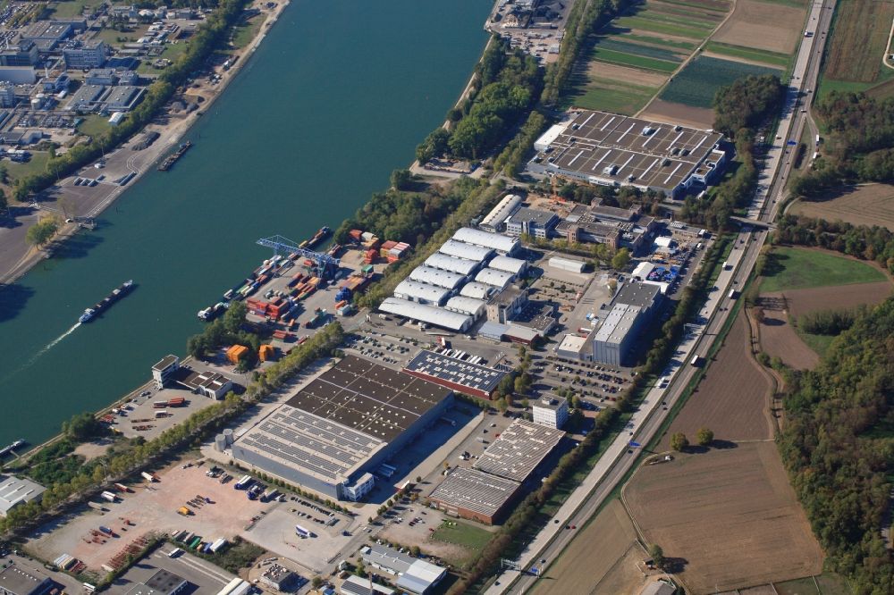 Weil am Rhein from the bird's eye view: Industrial and commercial area Rebgarten with with the premises of automotive manufacturer ARaymond in Weil am Rhein in the state Baden-Wurttemberg, Germany