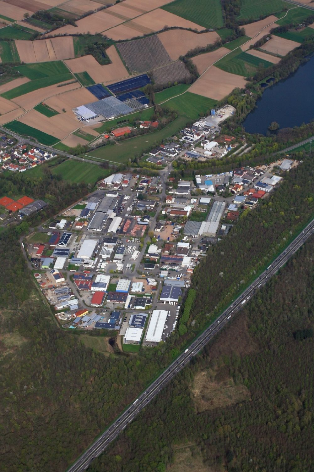 Teningen from above - Industrial and commercial area and bathing lake in Teningen, district Nimburg, in the state Baden-Wuerttemberg, Germany