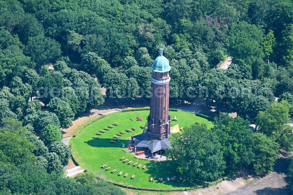 Berlin from the bird's eye view: Building of the industrial monument water tower in the summer garden Jungfernheide with the open-air restaurant summer garden Jungfernheide in Berlin, Germany