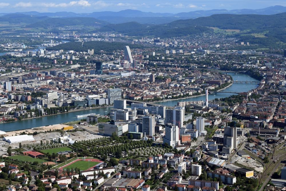 Basel from above - City area on the banks of river Rhine at Novartis Campus in Basel, Switzerland, and (left) the tends of the remediation area ARA Steih in Huningue, France