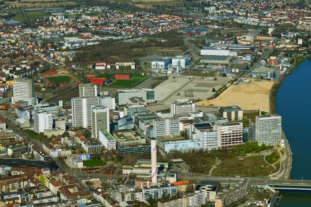Aerial image Basel - City area on the banks of river Rhine at Novartis Campus in Basel, Switzerland, and in the rear, just across the border to France the area of the remediated former sewage treatment plant Steih in Huningue, France