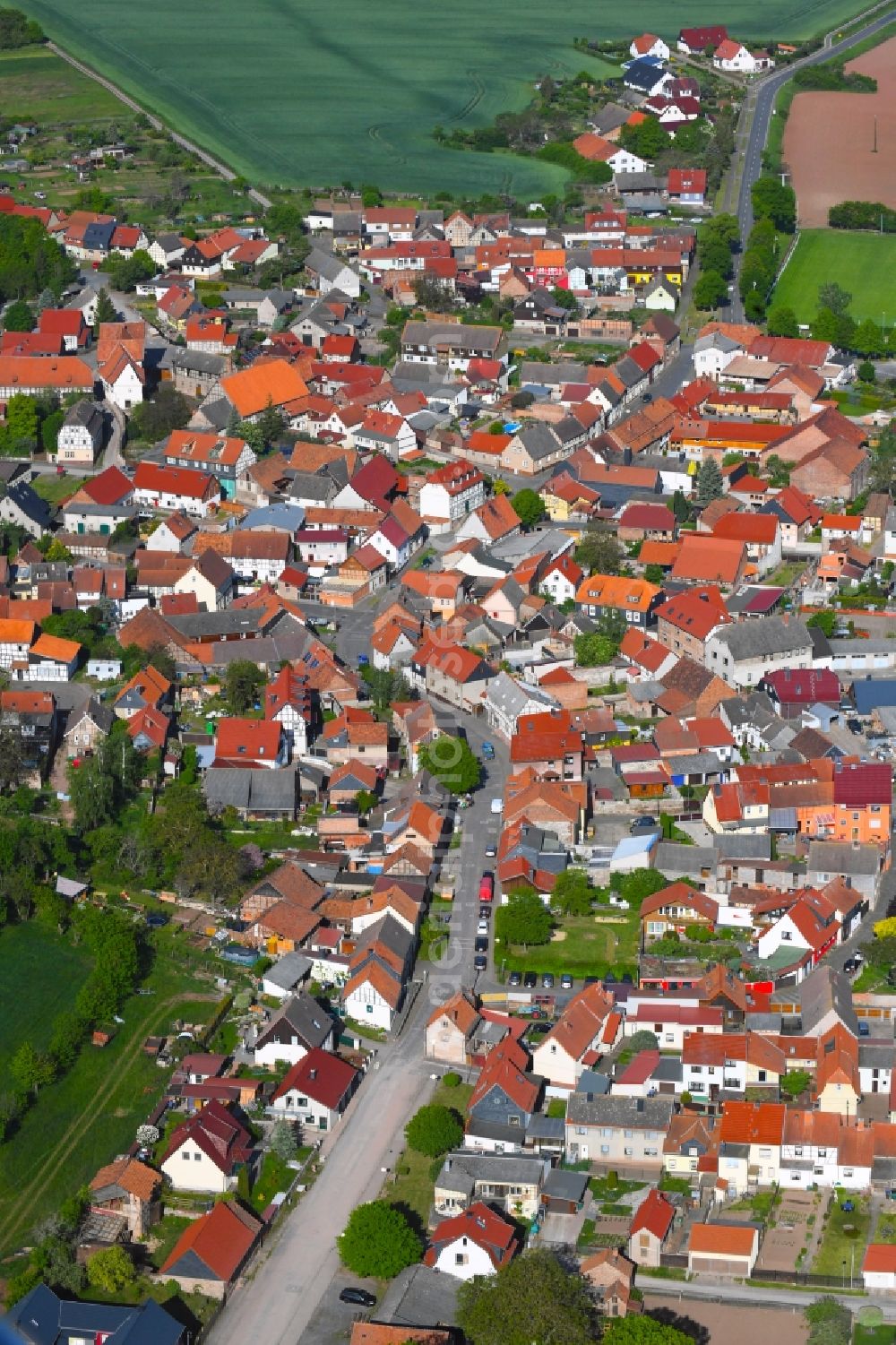 Auleben from above - City view from the downtown area with the outskirts with adjacent agricultural fields in Auleben in the state Thuringia, Germany