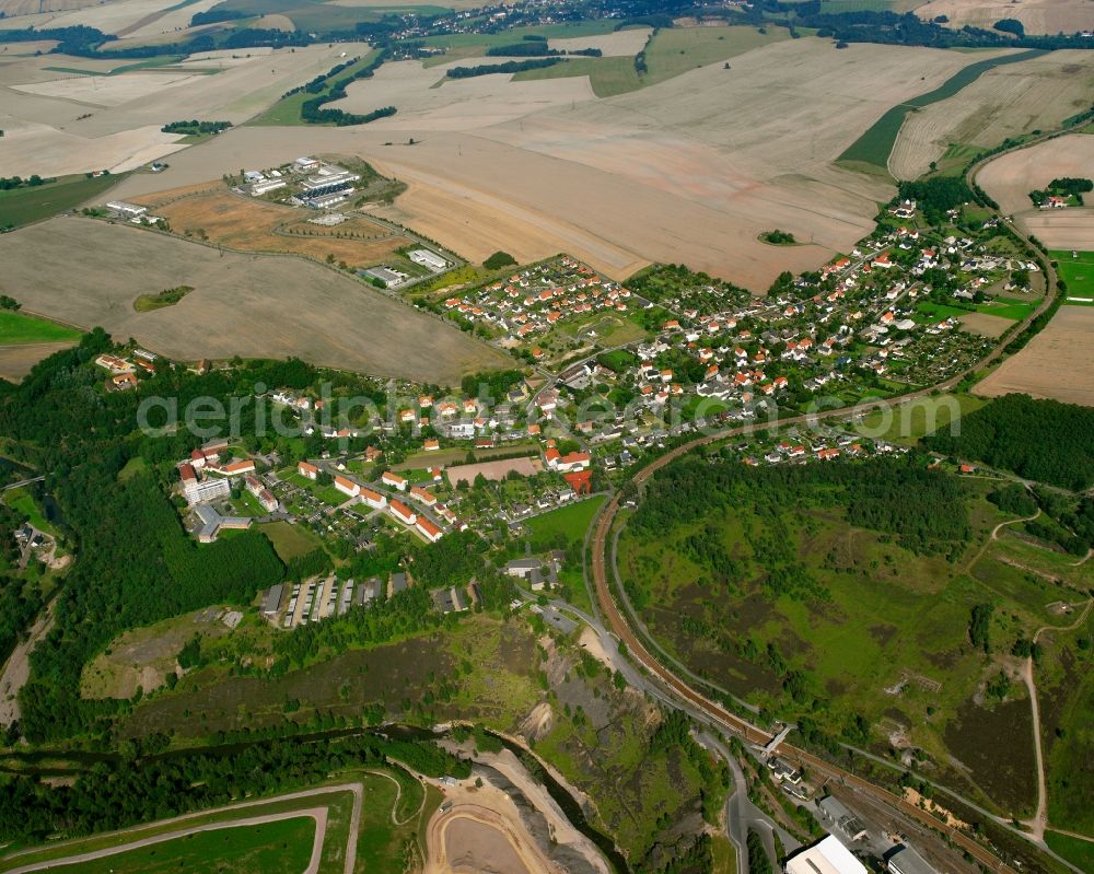 Hilbersdorf from the bird's eye view: City view from the downtown area with the outskirts with adjacent agricultural fields in Hilbersdorf in the state Saxony, Germany