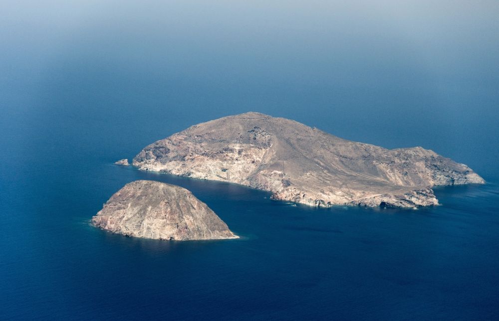 Aerial image Christiana Inseln - Christiana islands in Santorini in Greece archipelago. The uninhabited Greek islands of Christiana (Greek ????????? (n. pl.)) consist of three small islands and several rocks in the Southern Aegean Sea. Administratively, the Christiana Islands belong to the municipality of Thira, which is called most Santorini, in the region of South Aegean