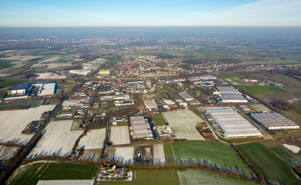 Aerial photograph Hamm - Industrial and commercial area in Hamm in the state North Rhine-Westphalia. In the foreground are the two companies DELTA Qualitaetsstahl and Friedrich Biermann Logistik und Spedition GmbH. In the back are two logistics centres by Edeka and Netto as well as the furniture retailer Finke