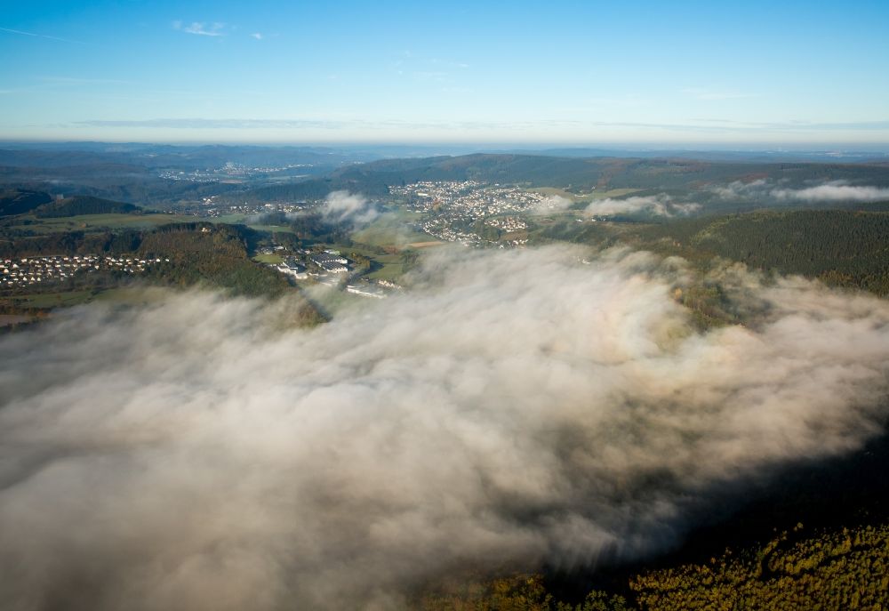 Meschede from the bird's eye view: Inversion - Weather conditions at the horizon in Freienohl in Meschede in the state North Rhine-Westphalia