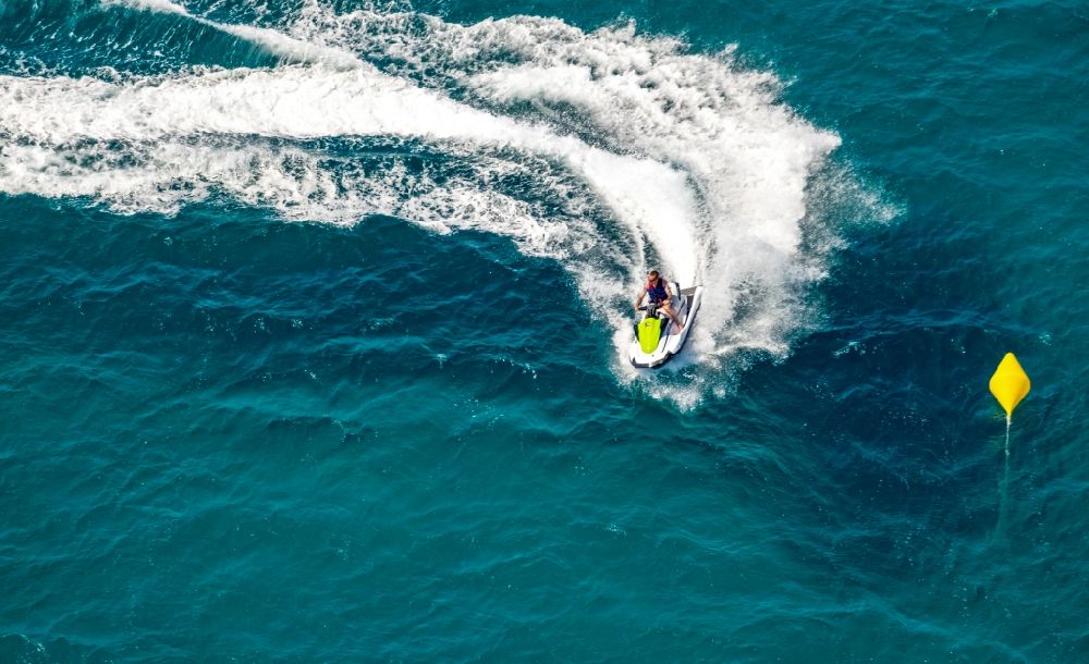 Palma from the bird's eye view: Jetski Sport boat - rowing boat ride in the bay of Palma in Palma in Balearic island of Mallorca, Spain