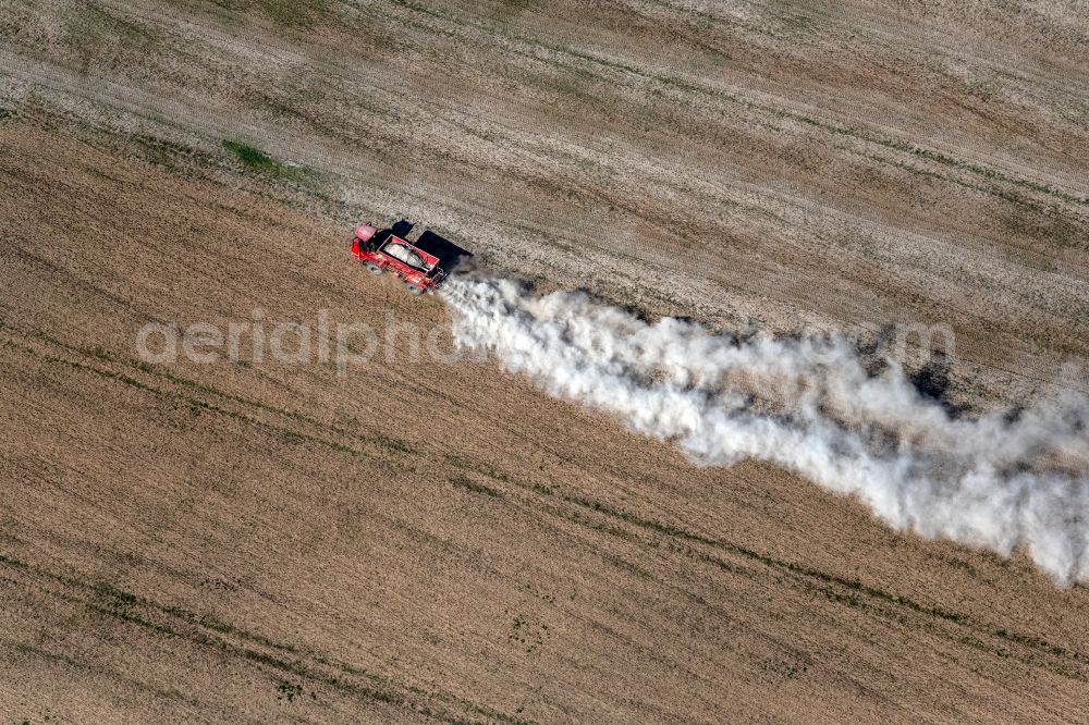 Trebnitz from above - Spraying of lime as fertilizer with tractor and special attachment on agricultural fields in Trebnitz in the state Saxony-Anhalt, Germany