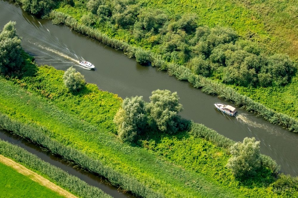 Aerial image Malchin - Channel flow and river banks of the Peene - sewer with motorboats in Malchin in the state Mecklenburg - Western Pomerania