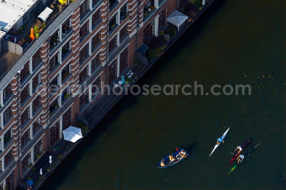 Leipzig from the bird's eye view: Canoeists and rowing boat in motion along the course of the Weisse Elster river in the district Schleussig in Leipzig in the state Saxony, Germany