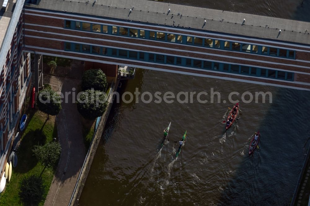 Aerial photograph Leipzig - Canoeists and rowing boat in motion along the course of the Weisse Elster river in the district Schleussig in Leipzig in the state Saxony, Germany