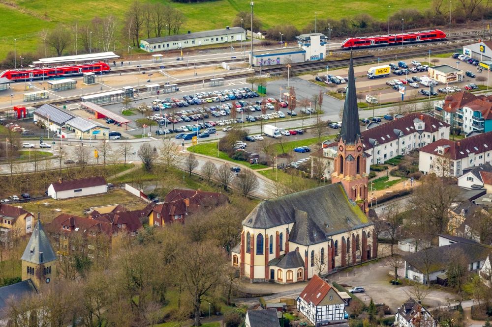 Fröndenberg/Ruhr from above - Church building of the catholic church of the family center in the pastoral network as well as parking lot and train station in Froendenberg/Ruhr in the state North Rhine-Westphalia, Germany