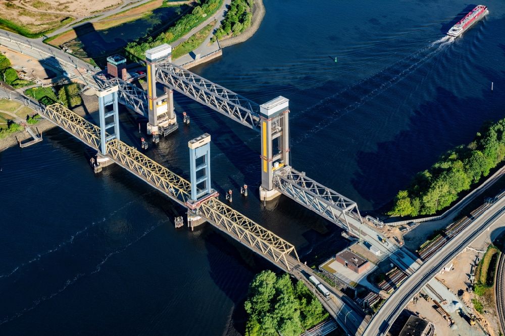Aerial photograph Hamburg - Bridge Kattwykbruecke across the Sued- Elbe in Hamburg, Germany. The bridge is located in the port of Hamburg and is being used for rail and road traffic. Kattwykdamm crosses the bridge with its blue tower