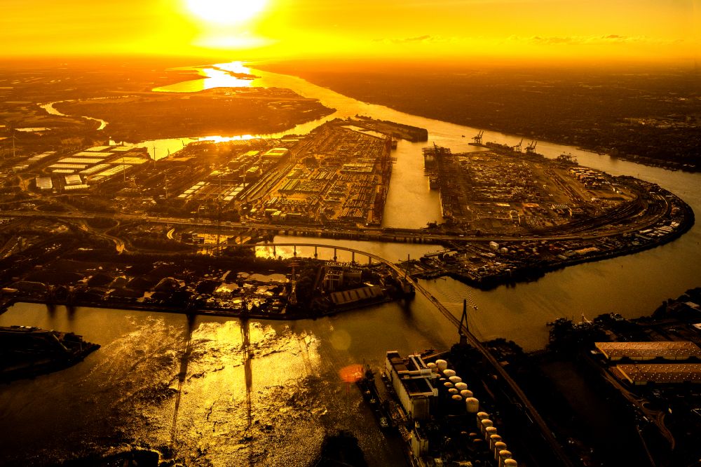 Hamburg from the bird's eye view: Koehlbrand bridge over the Rugenberg harbour at sunset in Hamburg-Mitte / Waltershof. A project of the Hamburg Port Authority HPA