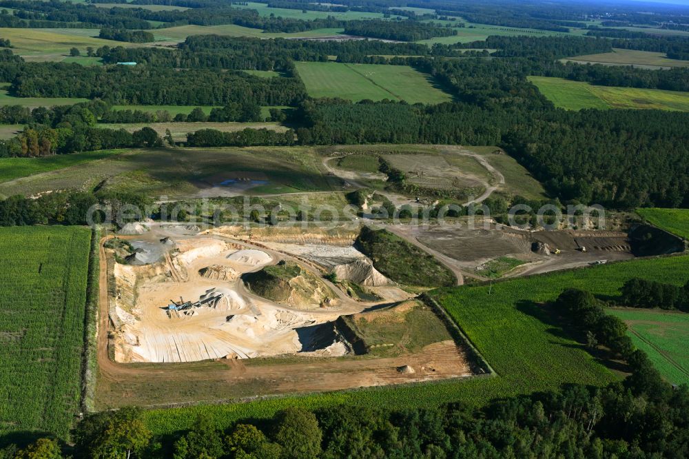 Dersenow from the bird's eye view: Site and tailings area of the gravel mining on street Am Sonnenberg in Dersenow in the state Mecklenburg - Western Pomerania, Germany