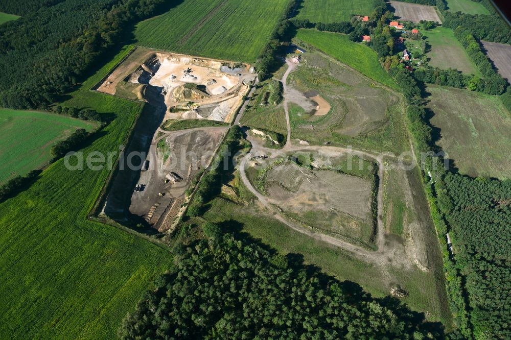 Dersenow from the bird's eye view: Site and tailings area of the gravel mining on street Am Sonnenberg in Dersenow in the state Mecklenburg - Western Pomerania, Germany