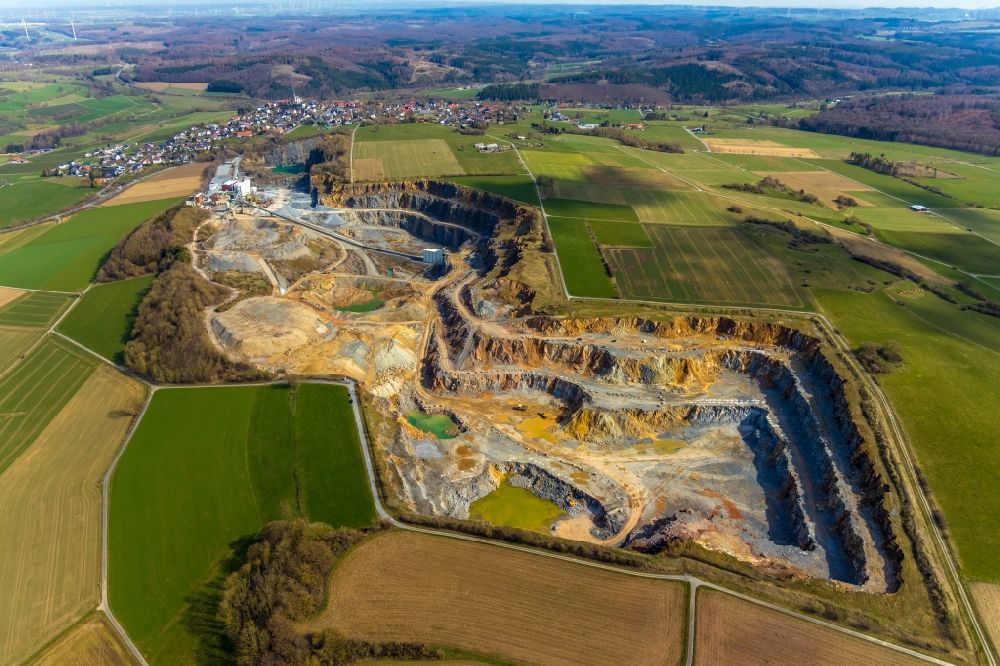Rüthen from the bird's eye view: Site and tailings area of the gravel mining of WESTKALK factory in the district Kallenhardt in Ruethen in the state North Rhine-Westphalia
