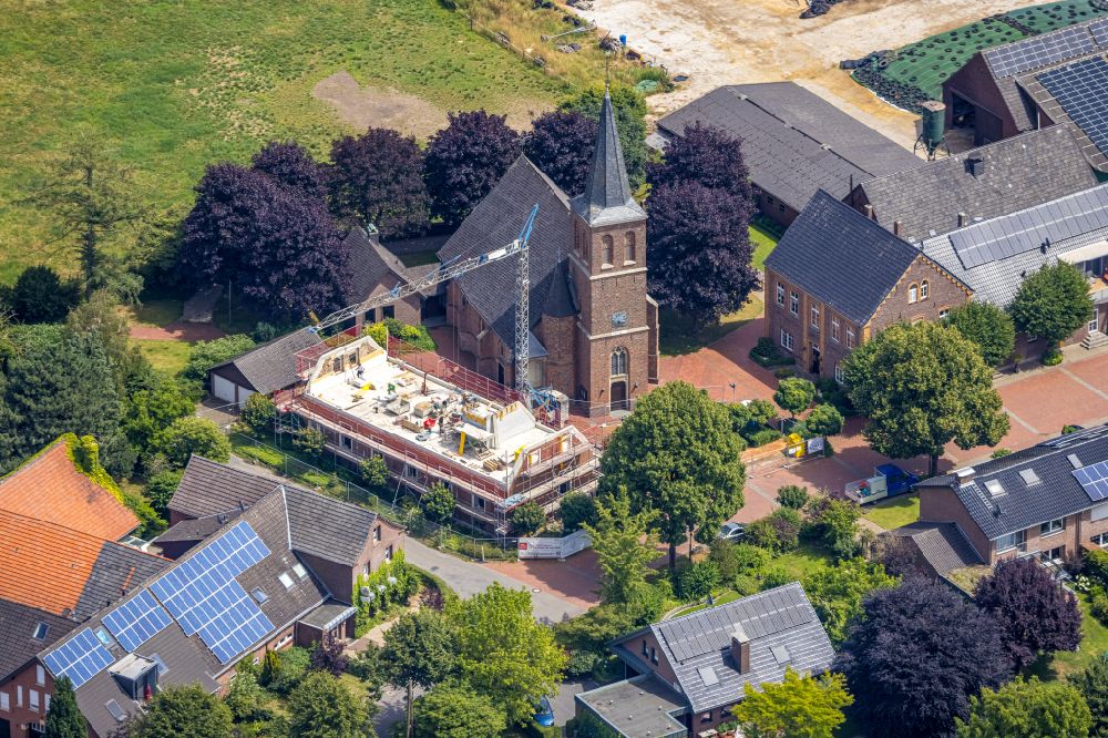 Hamminkeln from above - Church building St. Antonius with a construction site on street Antoniusstrasse in Hamminkeln in the state North Rhine-Westphalia, Germany