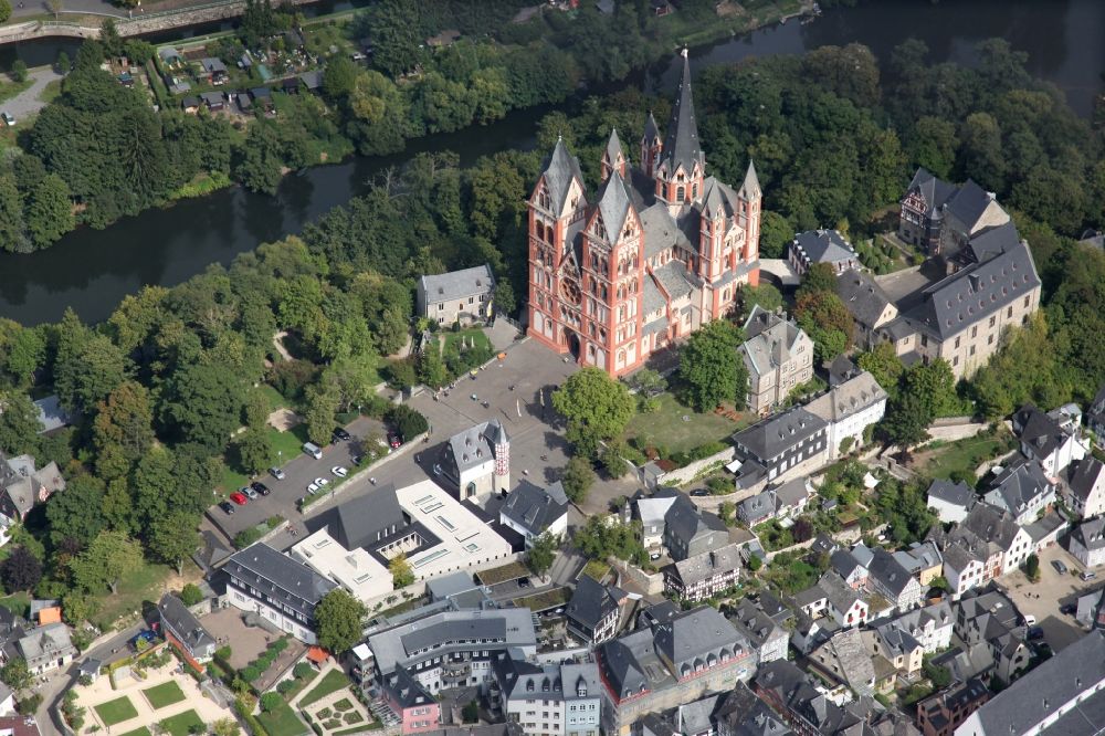 Limburg an der Lahn from the bird's eye view: Church building of the cathedral of Sankt Georg in Limburg an der Lahn in the state Hesse. The Limburg Cathedral, after his patron saint St. George also called Georgsdom, is the cathedral church of the diocese Limburg and is enthroned above the old town of Limburg an der Lahn Limburg next to the castle. The high location on the limestone rock above the Lahn ensures that the dome is visible from afar. The building is considered one of the most perfect creations of late Romanesque architecture. Besides is located the Diocesan Centre St. Nicholas in the diocese, the bishop's residence. For its high construction costs the former Bishop of Limburg, Franz-Peter Tebartz van Elst, should have been responsible