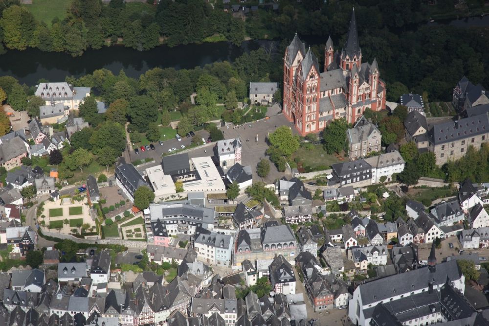 Aerial image Limburg an der Lahn - Church building of the cathedral of Sankt Georg in Limburg an der Lahn in the state Hesse. The Limburg Cathedral, after his patron saint St. George also called Georgsdom, is the cathedral church of the diocese Limburg and is enthroned above the old town of Limburg an der Lahn Limburg next to the castle. The high location on the limestone rock above the Lahn ensures that the dome is visible from afar. The building is considered one of the most perfect creations of late Romanesque architecture. Besides is located the Diocesan Centre St. Nicholas in the diocese, the bishop's residence. For its high construction costs the former Bishop of Limburg, Franz-Peter Tebartz van Elst, should have been responsible