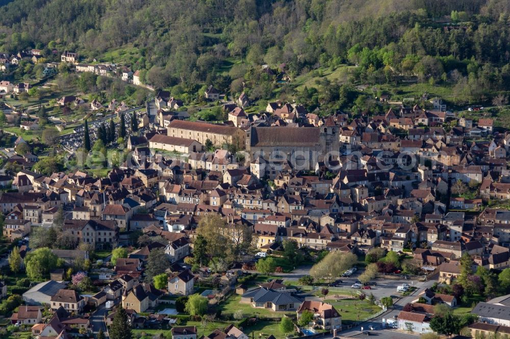 Aerial photograph Saint-Cyprien - Catholic Church building of Saint-Cyprien in the village of in Saint-Cyprien in Nouvelle-Aquitaine, France
