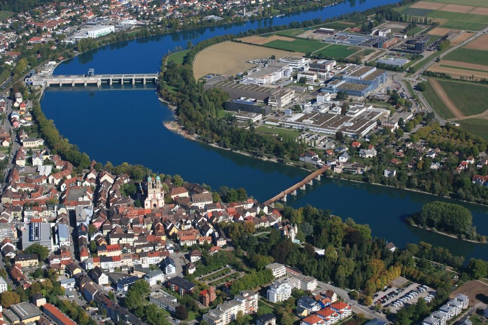 Bad Säckingen from above - Church building St. Fridolin in the Old Town- center of downtown in Bad Saeckingen in the state Baden-Wurttemberg. The historic wooden bridge over the river Rhine connects Germany with Switzerland and Novartis Stein