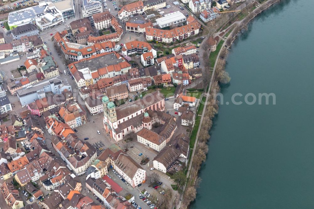 Aerial image Bad Säckingen - Church building St. Fridolin in the Old Town- center of downtown in Bad Saeckingen in the state Baden-Wurttemberg. The historic wooden bridge over the river Rhine connects Germany with Switzerland and Novartis Stein