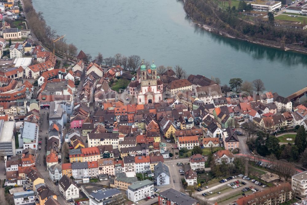 Bad Säckingen from the bird's eye view: Church building St. Fridolin in the Old Town- center of downtown in Bad Saeckingen in the state Baden-Wurttemberg. The historic wooden bridge over the river Rhine connects Germany with Switzerland and Novartis Stein